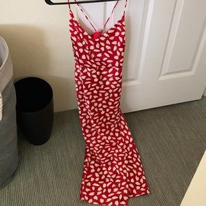 BRAND NEW red dress size small. Mid length with side slit